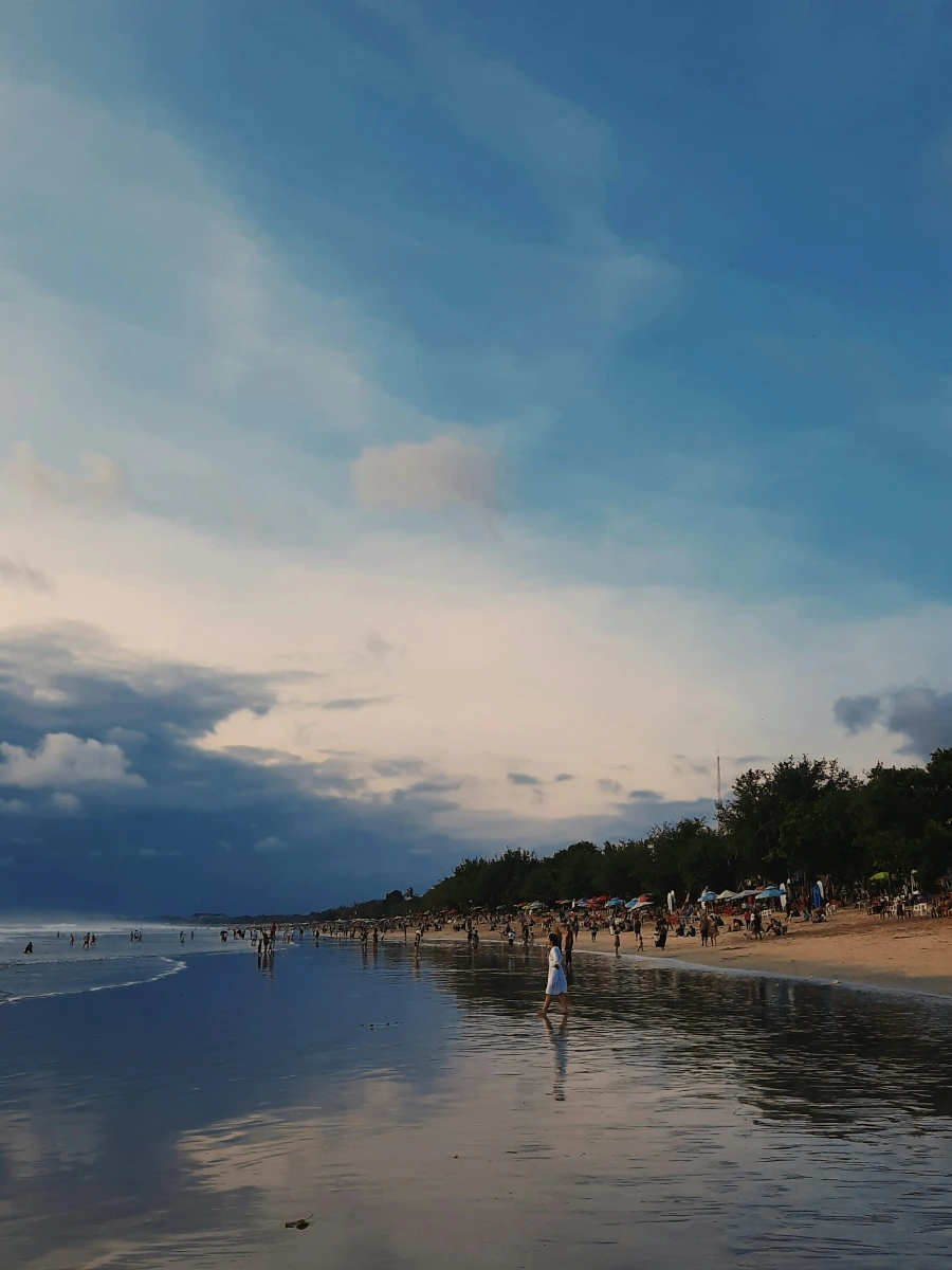 Kuta beach shoreline at low tide in the late afternoon